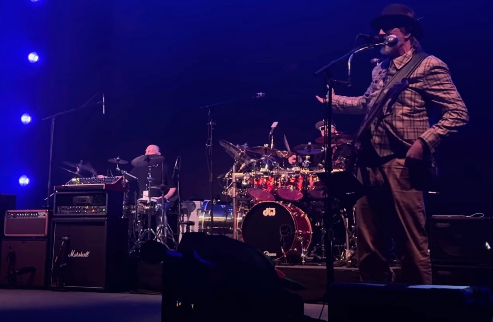 Photo of Bill Burr performing with Primus live.