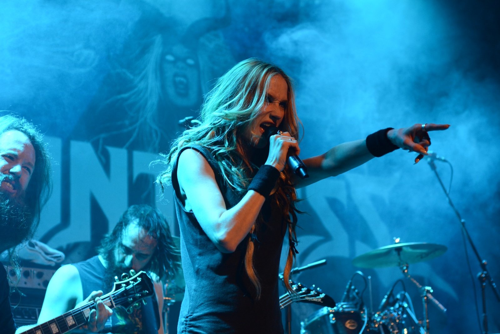 A photo of Jill Janus fronting the band Huntress,