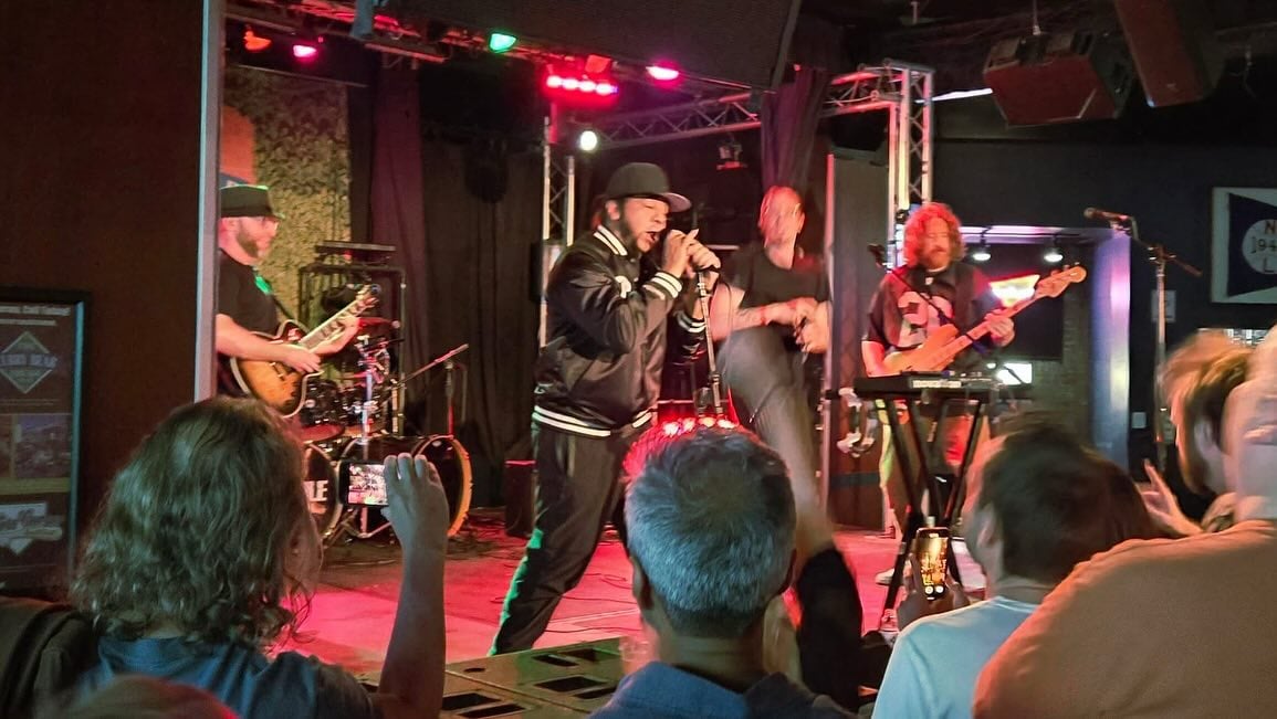 A photo of the System Of A Down cover band Peephole.