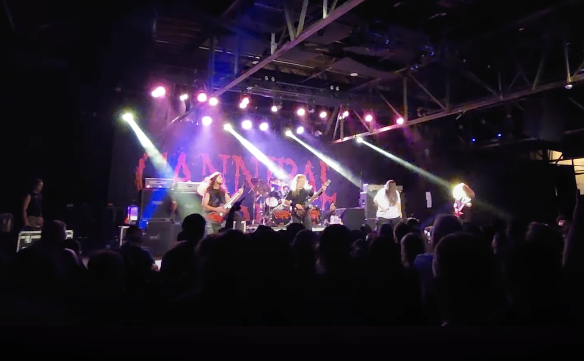 A photo of Cannibal Corpse live with Brandon Ellis.