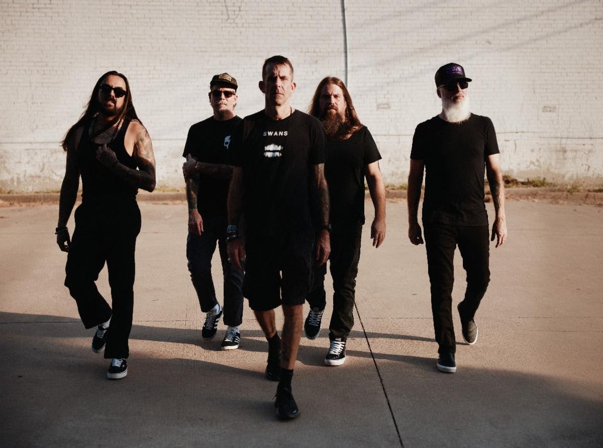 Promotional photo of Lamb of God featuring all five band members posed together in a studio setting