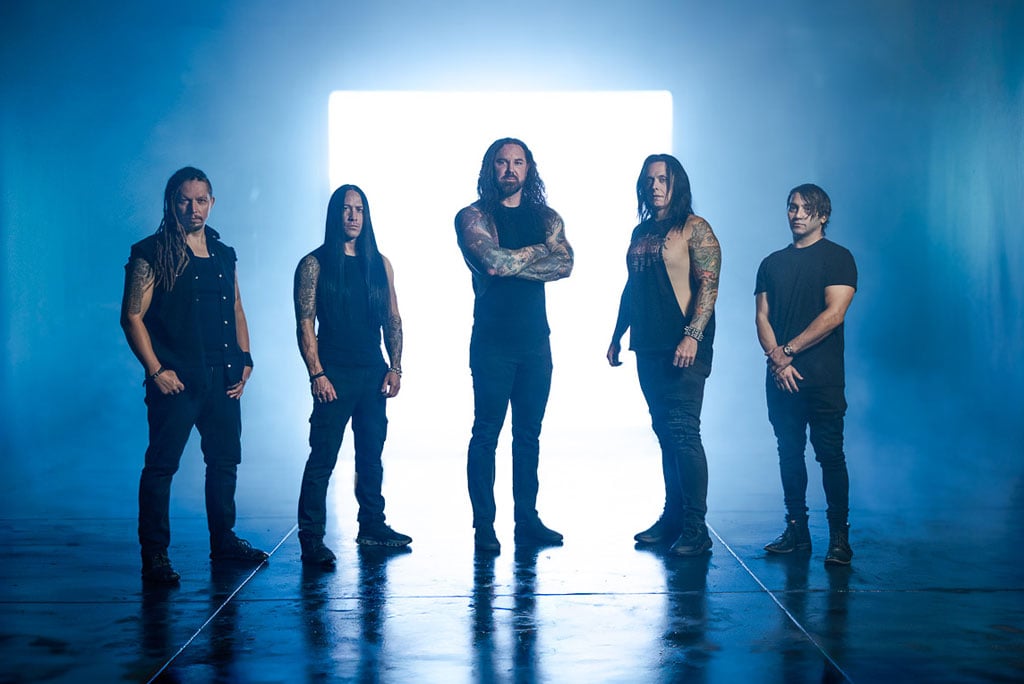 Promotional photo of As I Lay Dying in 2025 featuring Tim Lambesis (vocals), Chris Clancy (bass/clean vocals), Bill Hudson (guitar), Don Vedda (guitar), and Tim Yeung (drums).
