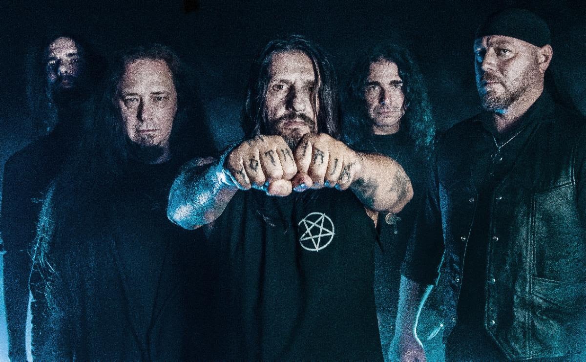 Promotional photo of Yoth Iria in 2026 featuring HE (vocals), Jim Mutilator (bass), Nikolas Perlepe (guitar), Naberius (guitar), and Bill "Vongaar" Stavrianidis (drums).